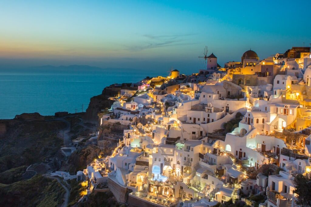 Santorini houses climbing the cliffside above the sea