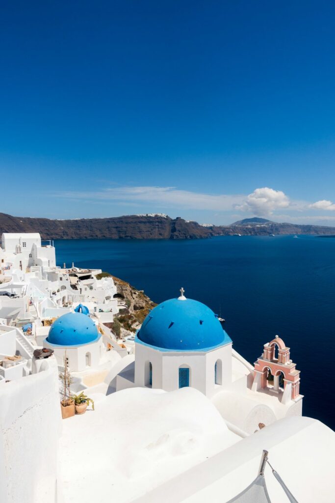 Whitewashed Santorini village cascading down the caldera cliffs